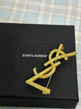 The classic YSL twisted-rope brooch from Yves Saint Laurent